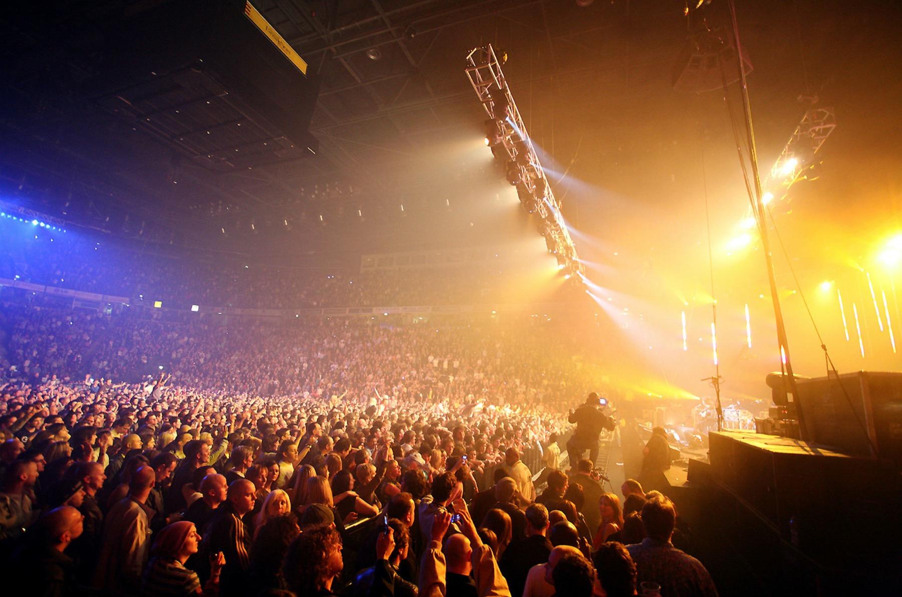 A packed Manchester arena crowd at a Versus Cancer fundraising concert.