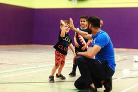 A school sports hall opened up for use by a local community club.